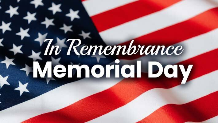American flag with the text, In Remembrance Memorial Day. 