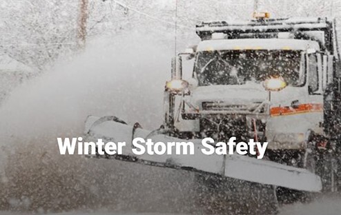 Winter Storm Safety. A snowplow surrounded by snow.