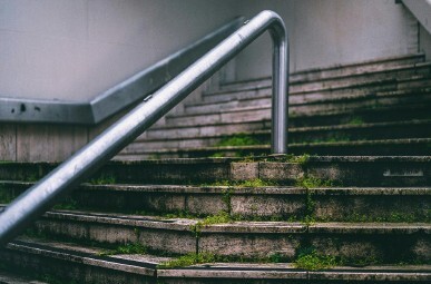 A staircase that looks slippery with moss. 